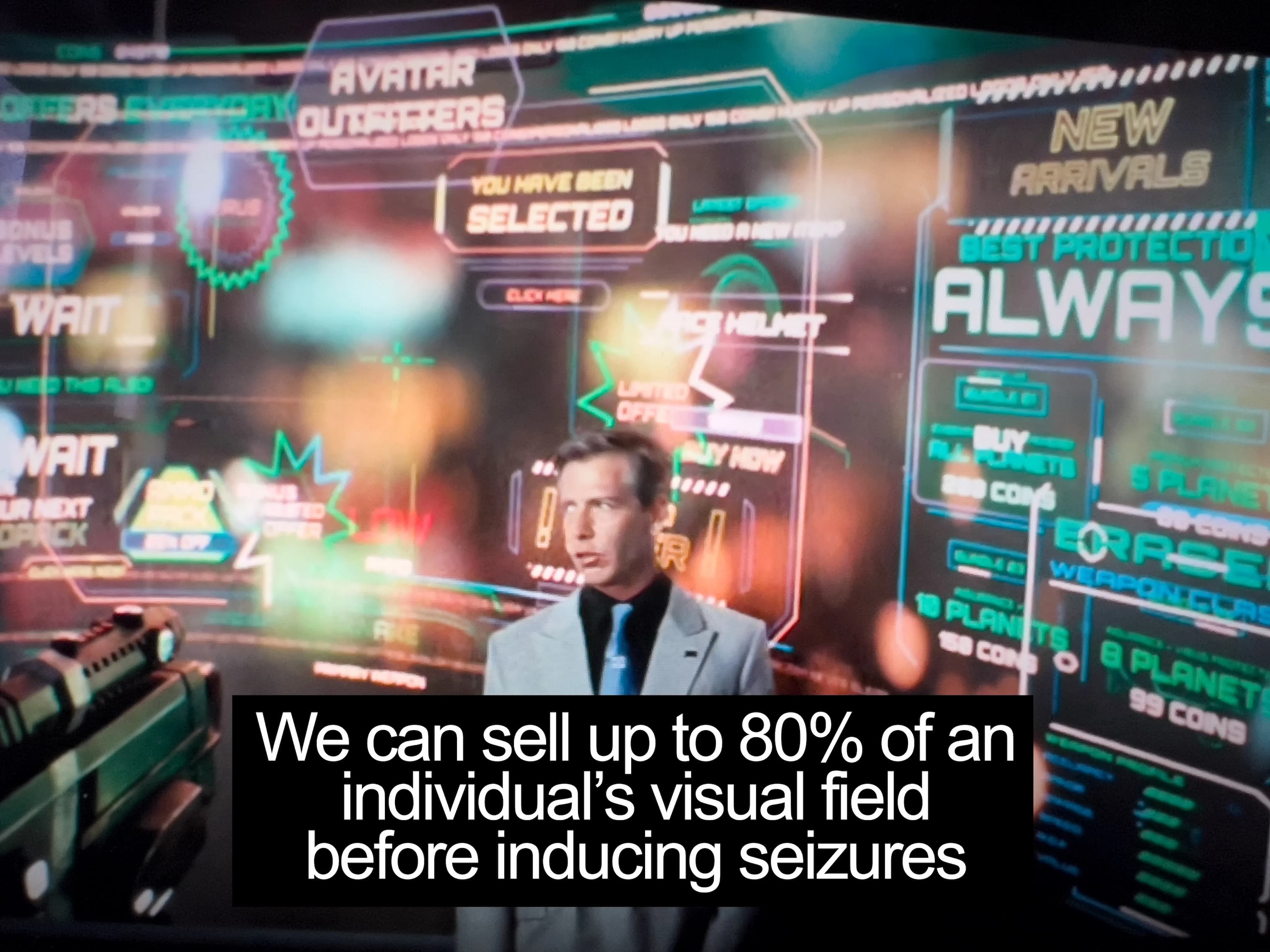 A shot of the movie Ready Player One where the antagonist is pitching the idea that they can use up to 80% of an individual's field of vision before inducing seizures