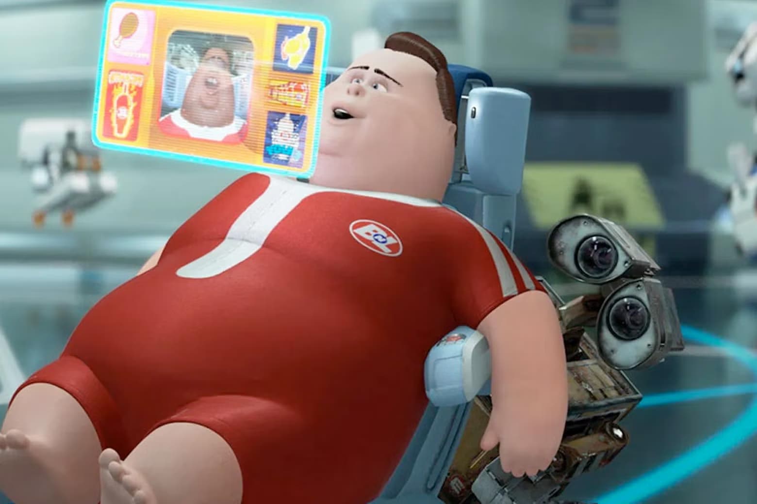 Wall-E movie shot depicting an overweight man watching a screen with no care for reality